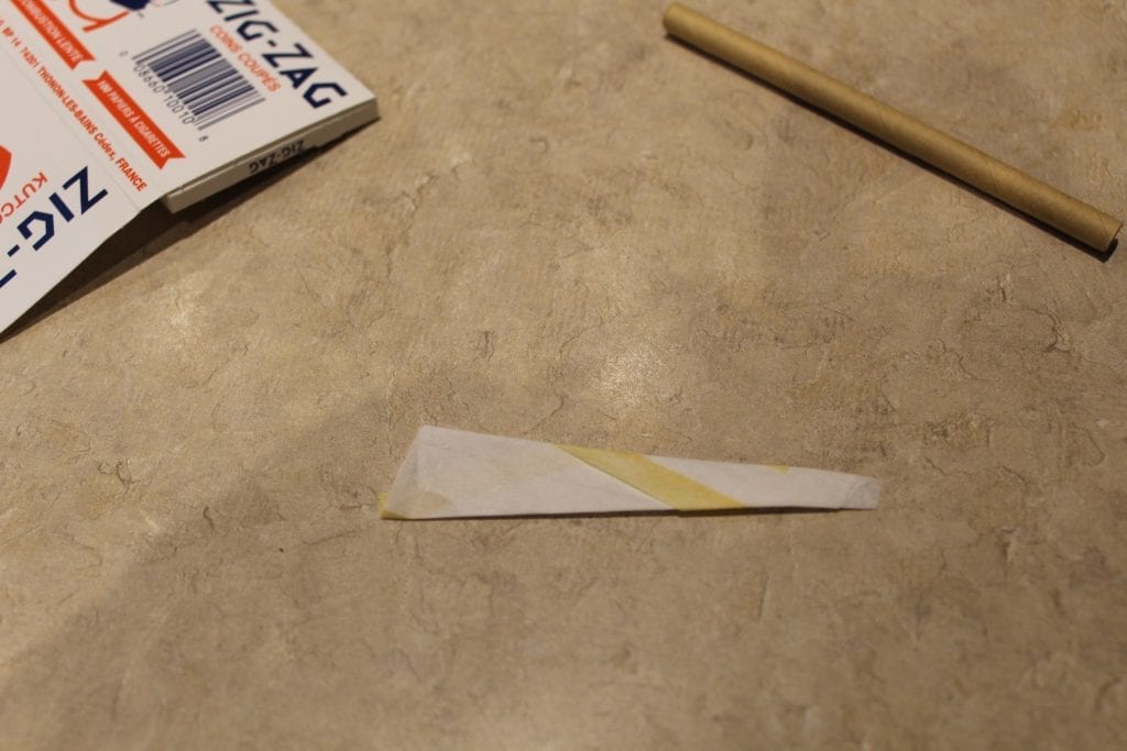 Rolling paper folded into the shape of a cone