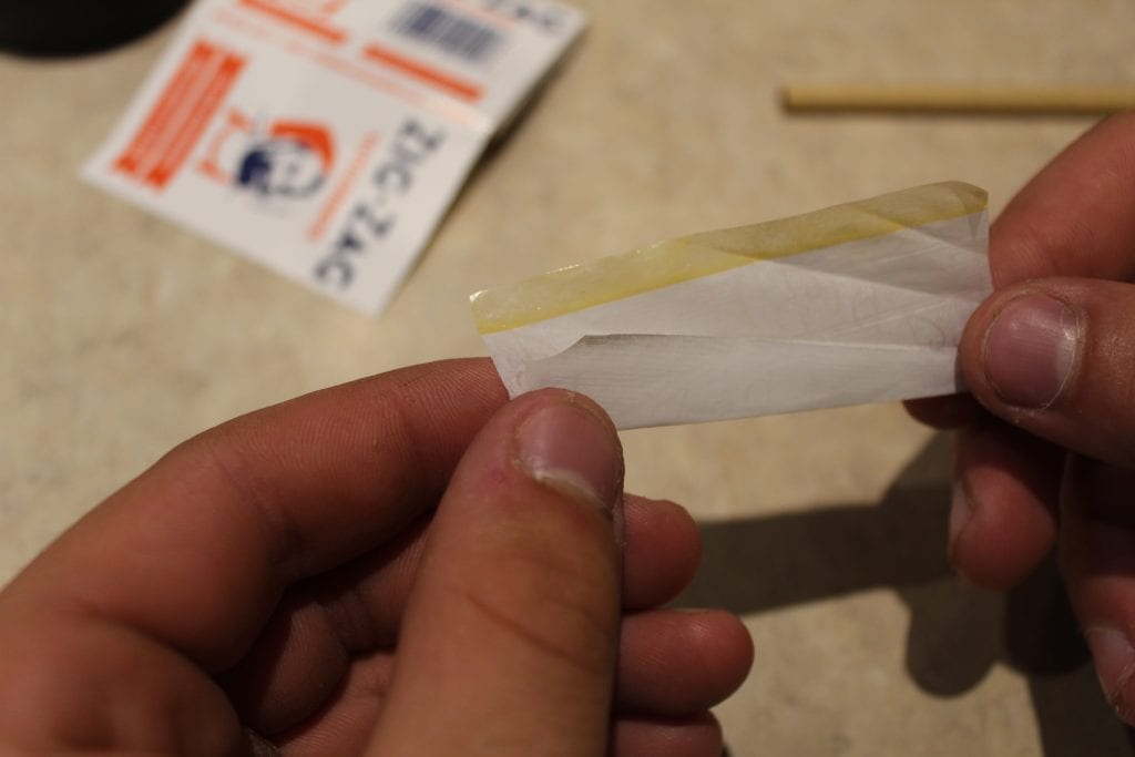 rolling paper pre-rolled with wet adhesive after being licked. 