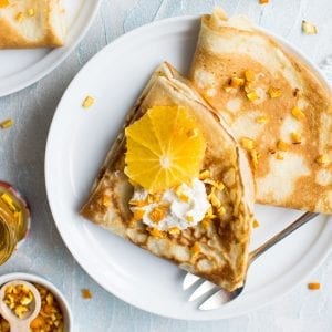 weed crepes that are golden brown with oranges on them.