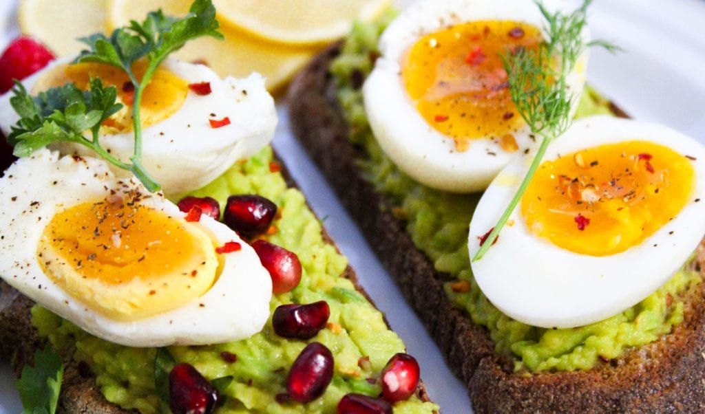 Guacamole toast with devilled eggs and cranberries.