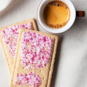 cannabis infused pop tarts on a tablecloth with a cup of coffee beside them