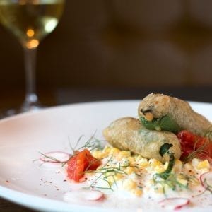 cannabis Jalapeño Poppers with fresh jalapeno, lump crab meat, beer batter and cool creamed corn salad