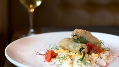 cannabis Jalapeño Poppers with fresh jalapeno, lump crab meat, beer batter and cool creamed corn salad