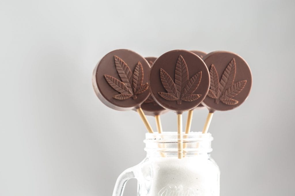 4 weed edible lollipops in a milkshake that is infused with cannabis.