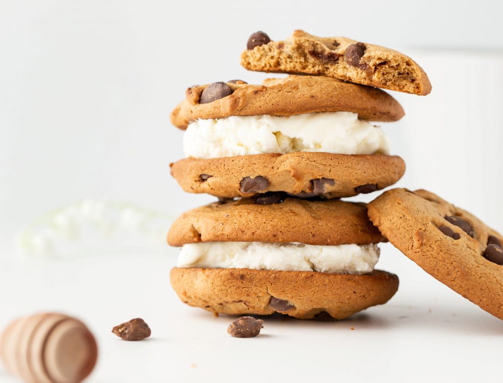 weed ice cream sandwich cookie on a white plate. Three ice cream sandwich cookies stacked on top of each other. 