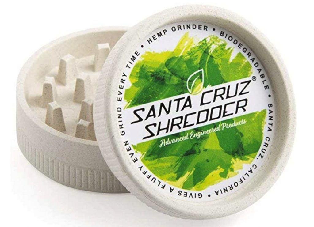 Santa Cruz Shredder two piece hemp grinder on a white table 